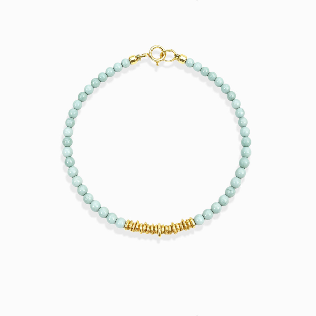Dainty gold beaded Calm Tide turquoise chip bracelet, natural pale aqua ocean crystal bracelet isolated white background