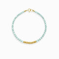 Dainty gold beaded Calm Tide turquoise chip bracelet, natural pale aqua ocean crystal bracelet isolated white background