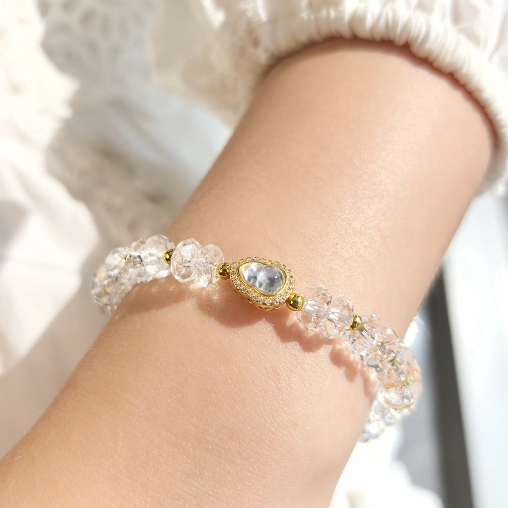 Close up of First Light clear quartz bracelet transparent natural crystal bead texture detail
