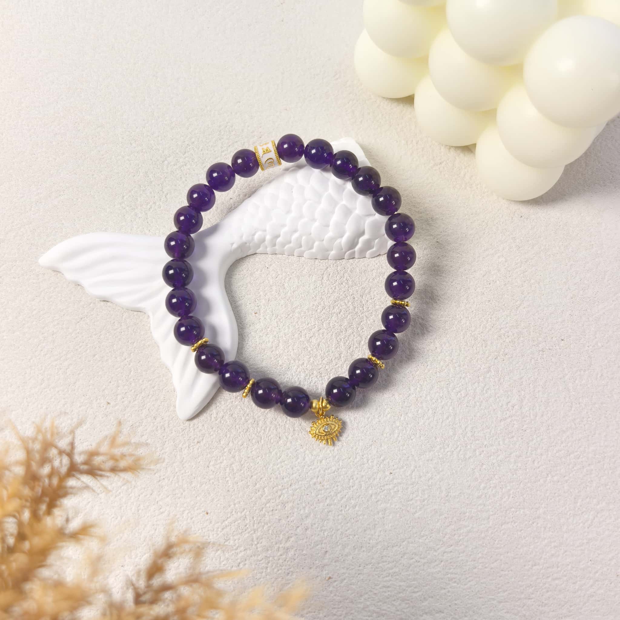 Ins style still life styling of Amethyst Aura Evil Eye Bracelet, intuition purple aura crystal jewelry for daily wear.