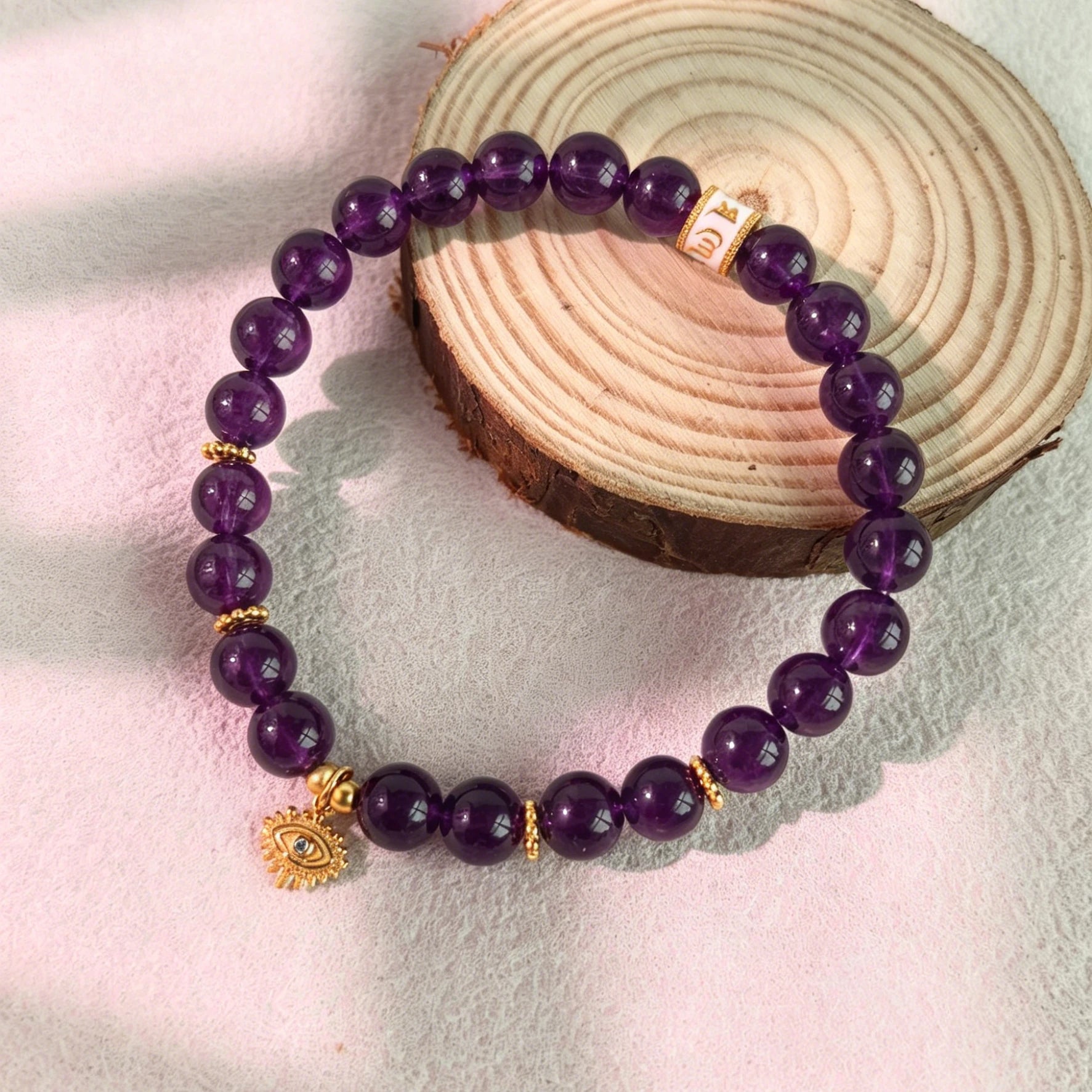 Soft ins style still life styling of Amethyst Aura Evil Eye Bracelet, elegant witchy feminine purple aura crystal spiritual jewelry decor