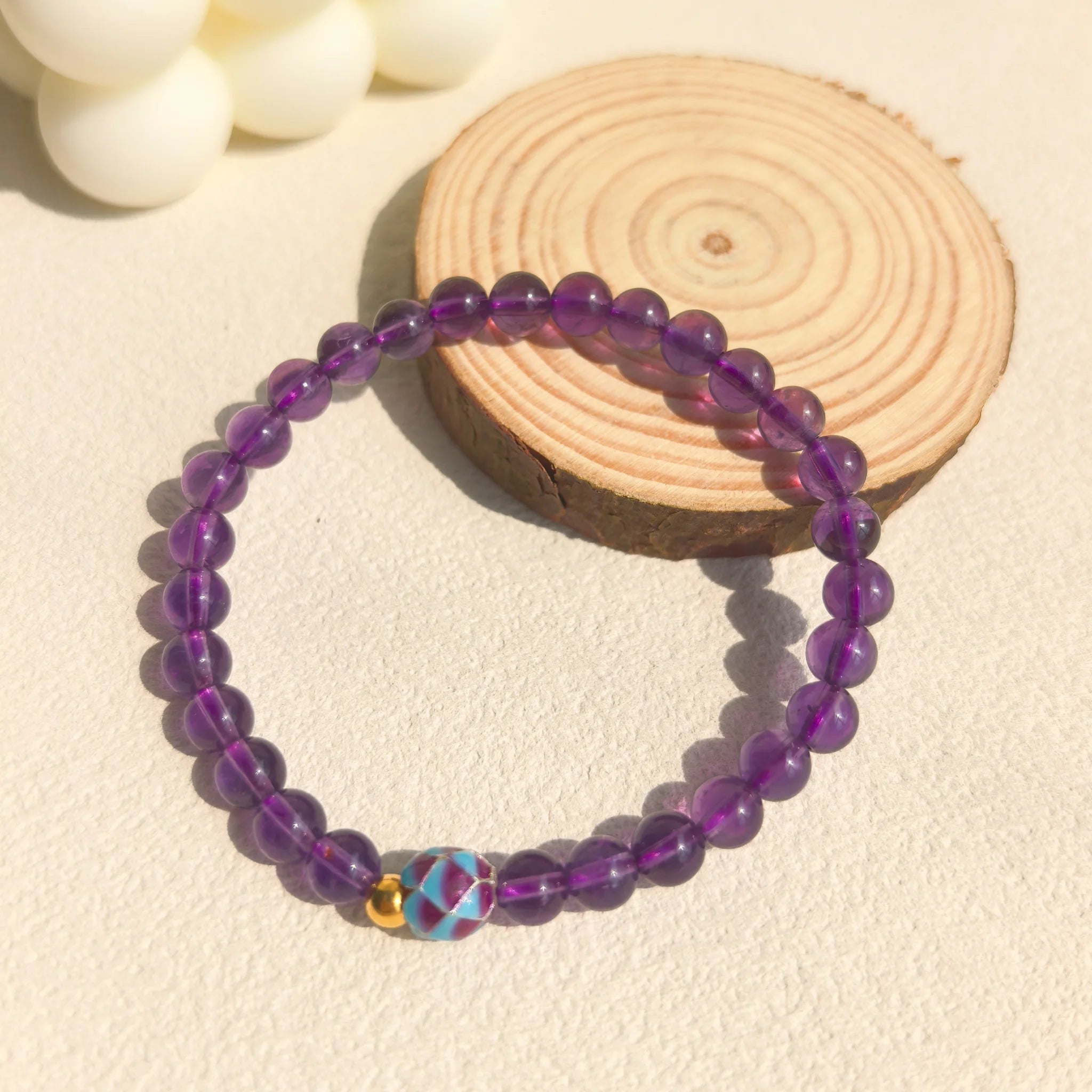 Soft ins style still life styling of Amethyst Lotus Bloom Bracelet, tranquil witchy feminine purple crystal spiritual jewelry decor