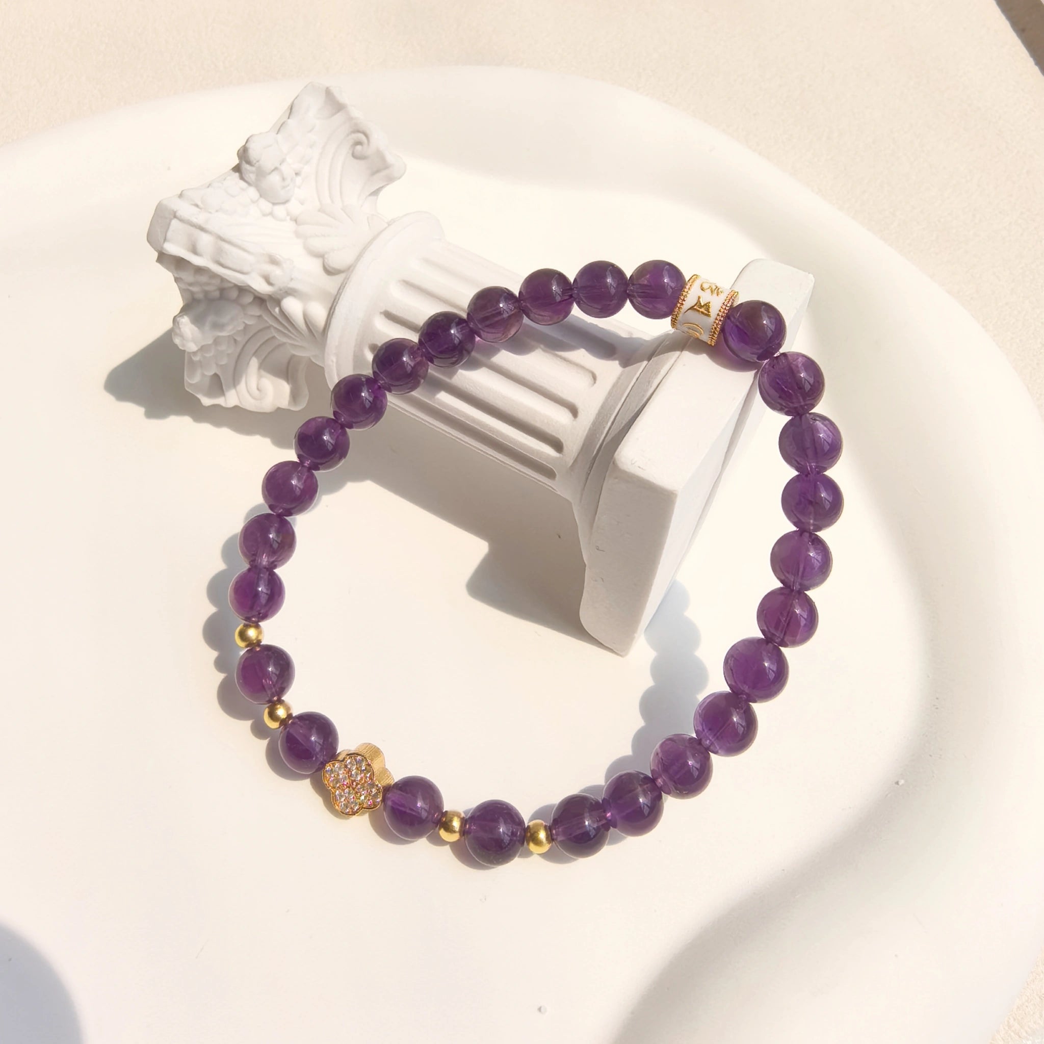 Side angle of Amethyst Lucky Clover Mantra Bracelet, anxiety relief crystal jewelry for third eye chakra