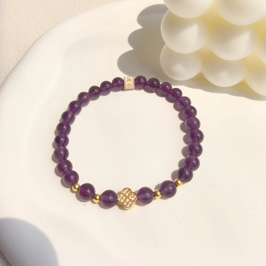 Ins style still life shot of Amethyst Lucky Clover Mantra Bracelet, healing purple crystal spiritual jewelry for her