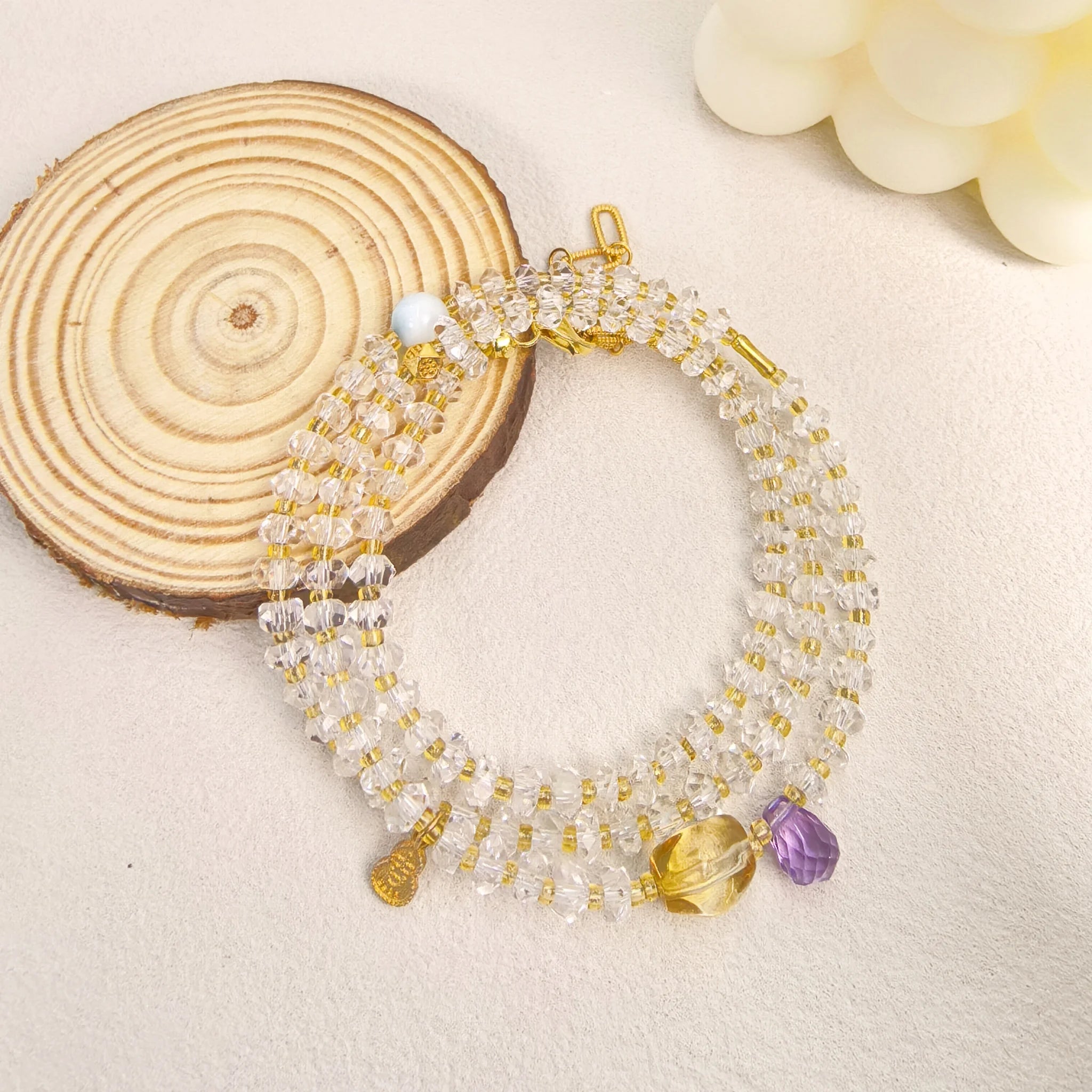 Ins style still life shot of Three Graces clear quartz wrap bracelet layered healing crystal gift for spiritual women