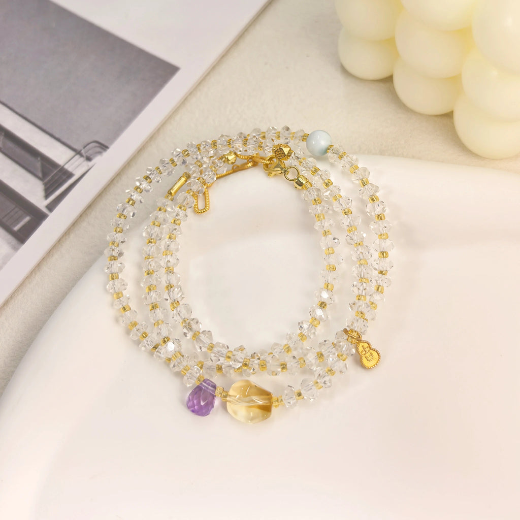 Ins style still life shot of Three Graces clear quartz wrap bracelet layered healing Crown Chakra with intuition