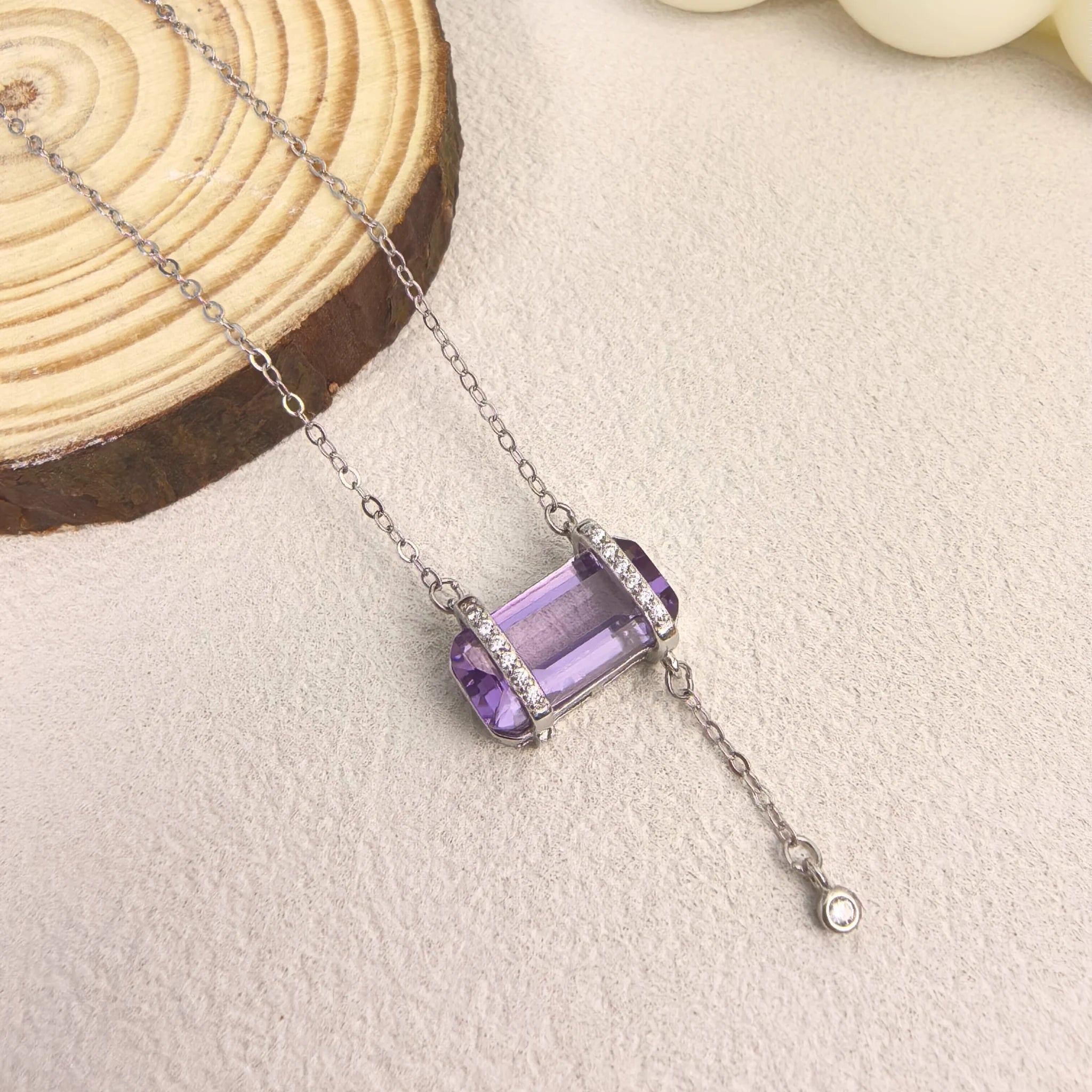 Ins aesthetic flat lay of Violet Reverie Amethyst Necklace, intuition crystal jewelry for daily wear.