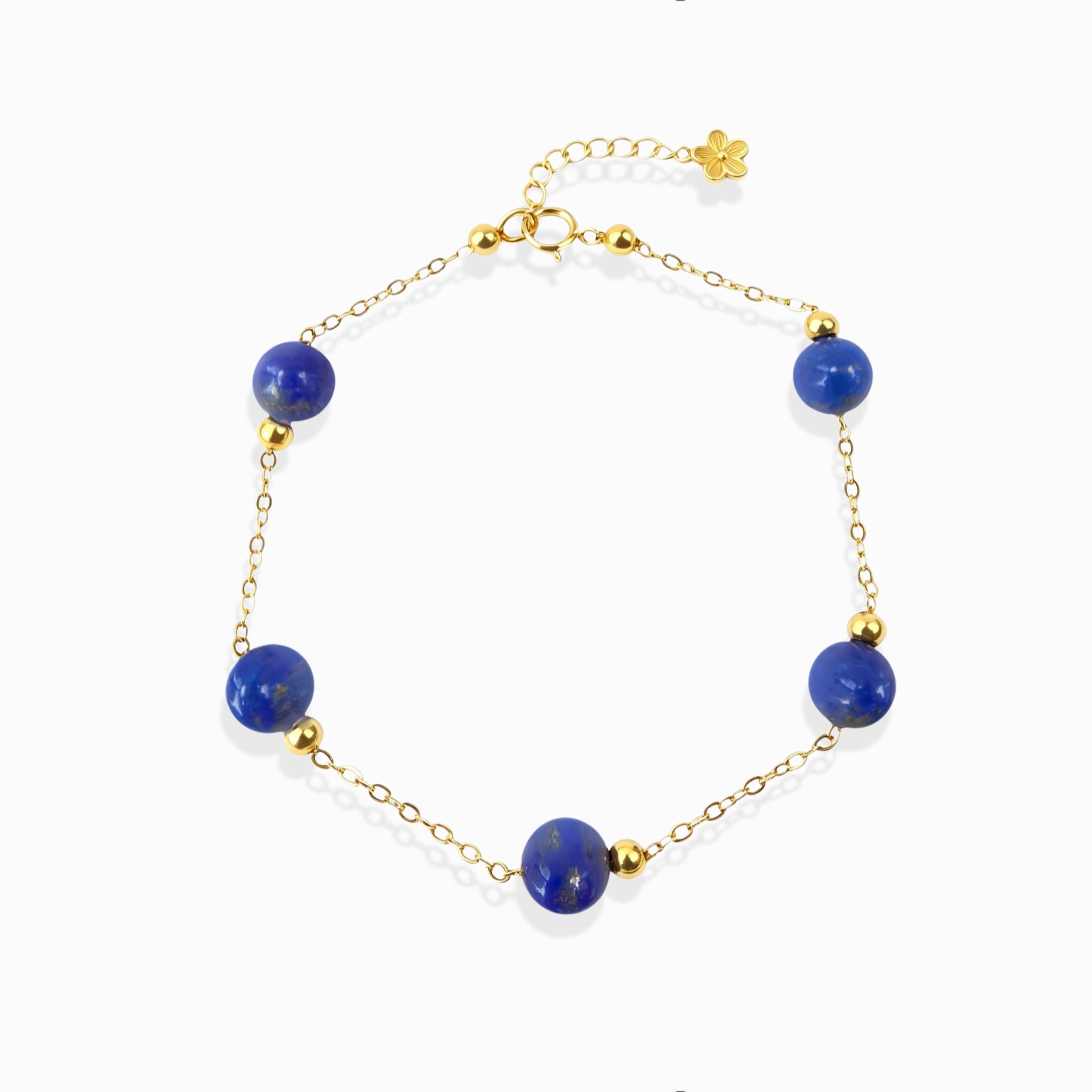 Milky Way Stroll Lapis Lazuli Bracelet with deep blue lapis beads, gold chain, white background dainty spiritual crystal jewelry for women