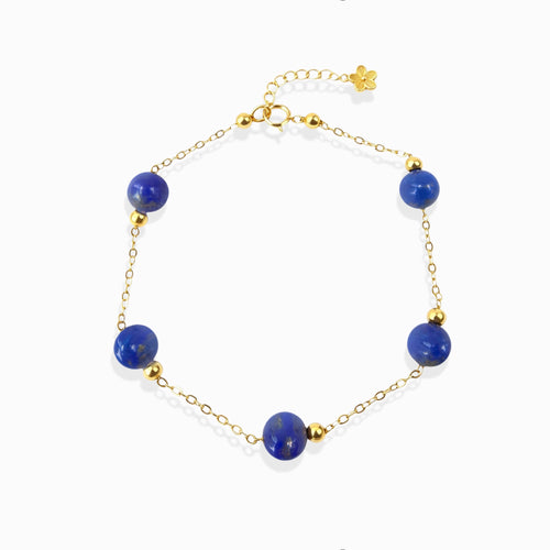 Milky Way Stroll Lapis Lazuli Bracelet with deep blue lapis beads, gold chain, white background dainty spiritual crystal jewelry for women