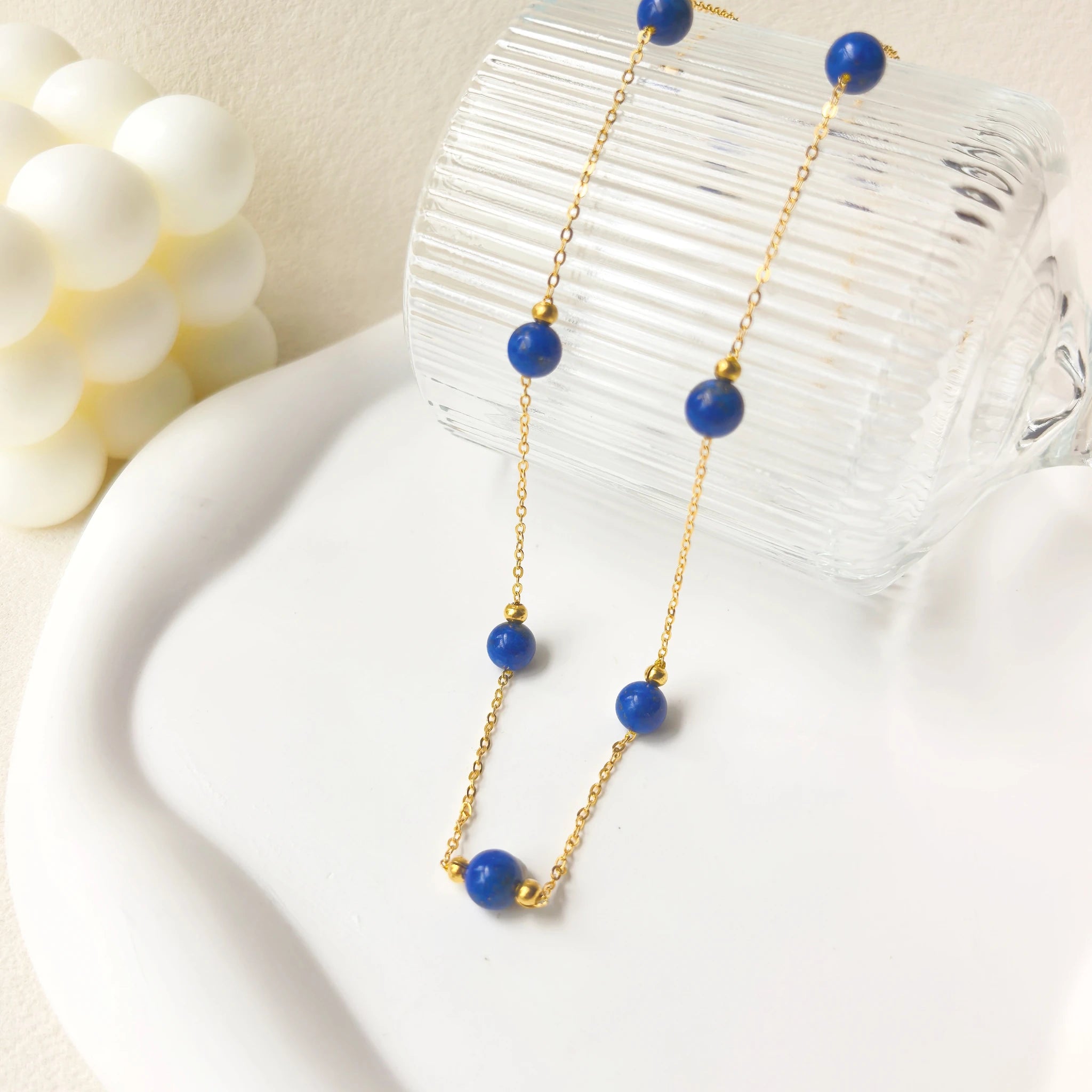 Ins aesthetic still life shot of Milky Way Stroll lapis lazuli necklace, celestial gemstone jewelry for everyday wear.