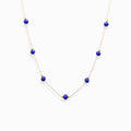 Dainty gold chain Milky Way Stroll lapis lazuli necklace, natural royal blue lapis bead choker isolated white background