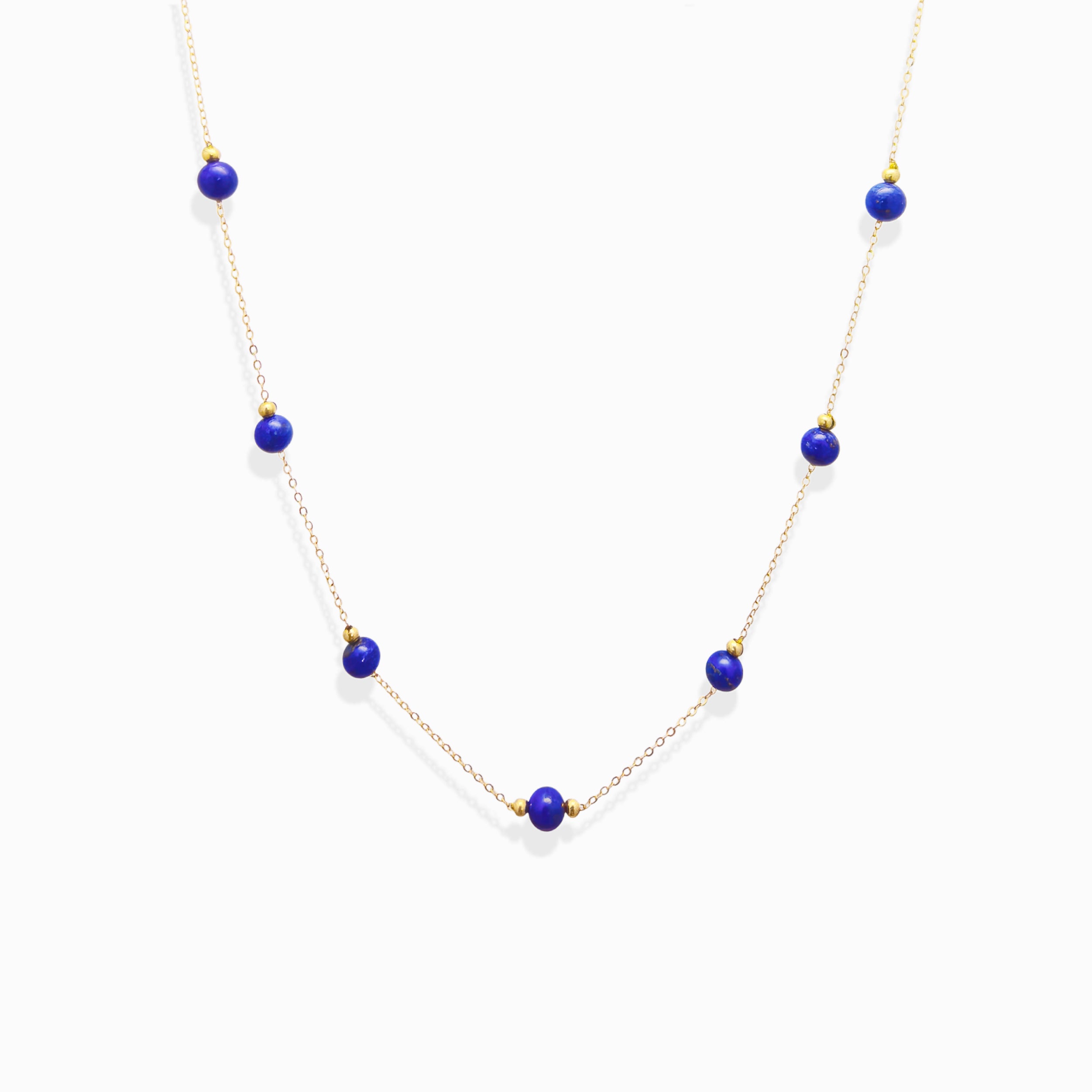 Dainty gold chain Milky Way Stroll lapis lazuli necklace, natural royal blue lapis bead choker isolated white background