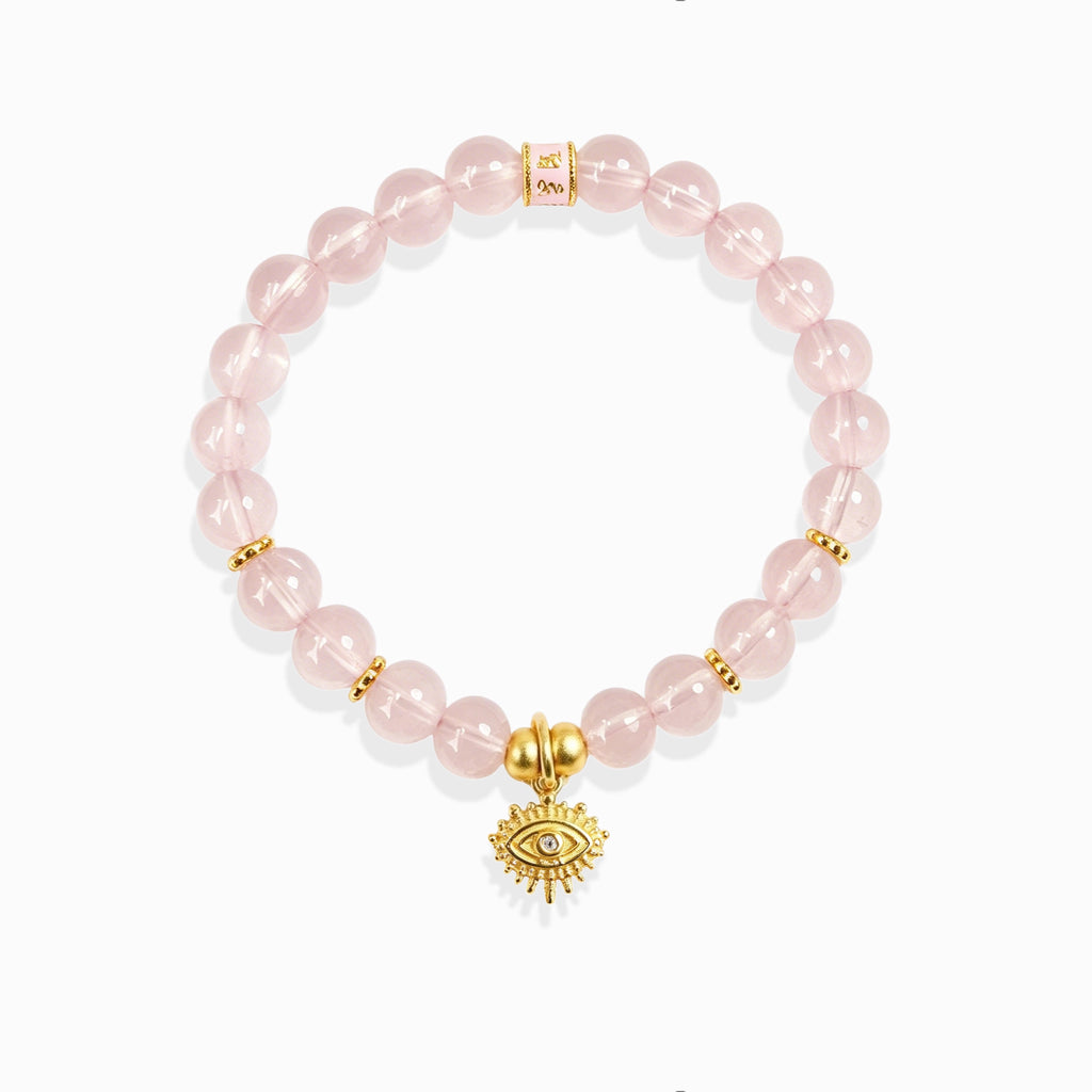 Clear luminous pink aura quartz bead evil eye protection bracelet with golden mantra spacer bead, white background spiritual crystal jewelry for women