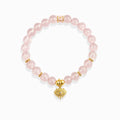 Clear luminous pink aura quartz bead evil eye protection bracelet with golden mantra spacer bead, white background spiritual crystal jewelry for women