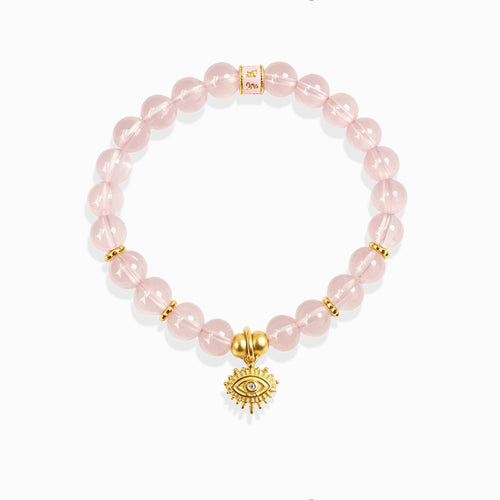 Clear luminous pink aura quartz bead evil eye protection bracelet with golden mantra spacer bead, white background spiritual crystal jewelry for women
