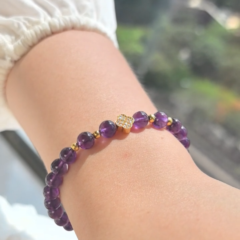 video of amethyst lucky clover mantra bracelet wearing on woman wrist.