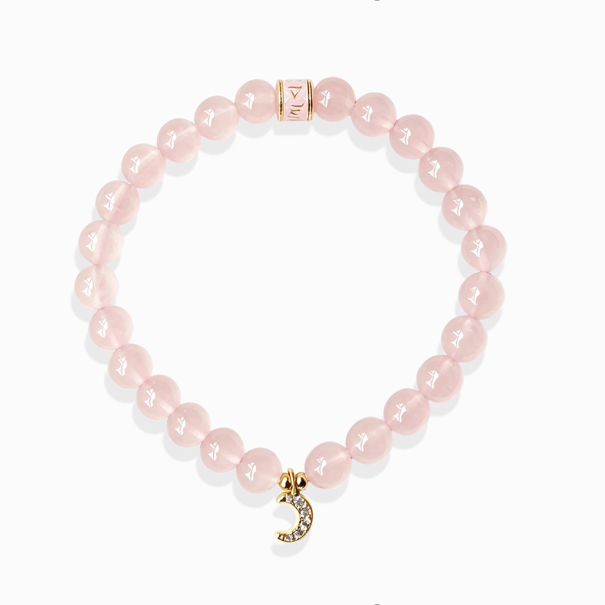 Rose quartz crescent moon charm bracelet healing jewelry on white background