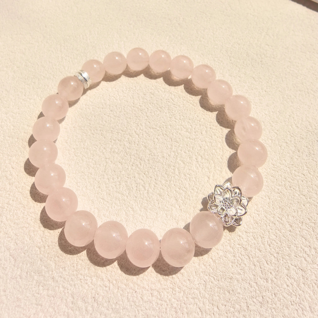 Side angle of Lotus Emotion Renewal Rose Quartz Bracelet， spiritual healing gift for her