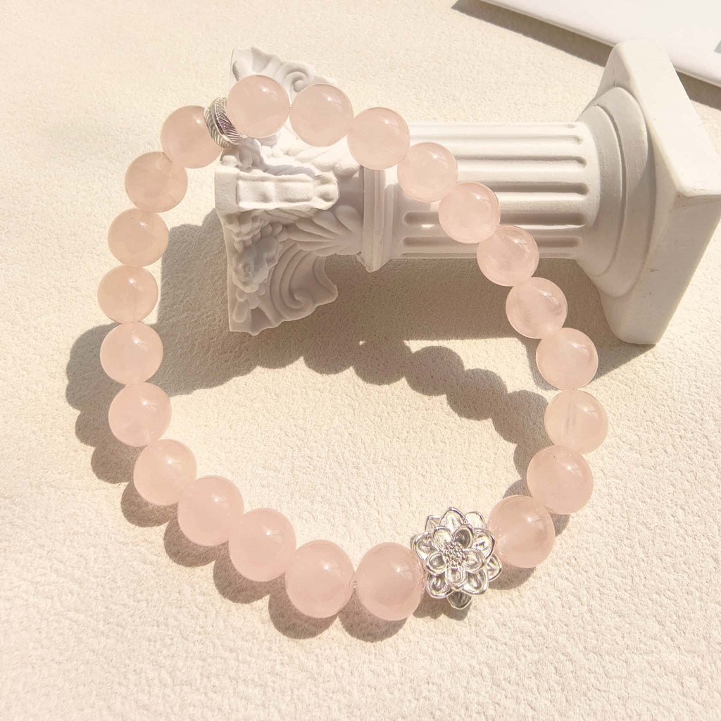 Soft ins aesthetic still life of Lotus Emotion Renewal Rose Quartz Bracelet, gentle healing crystal jewelry for women