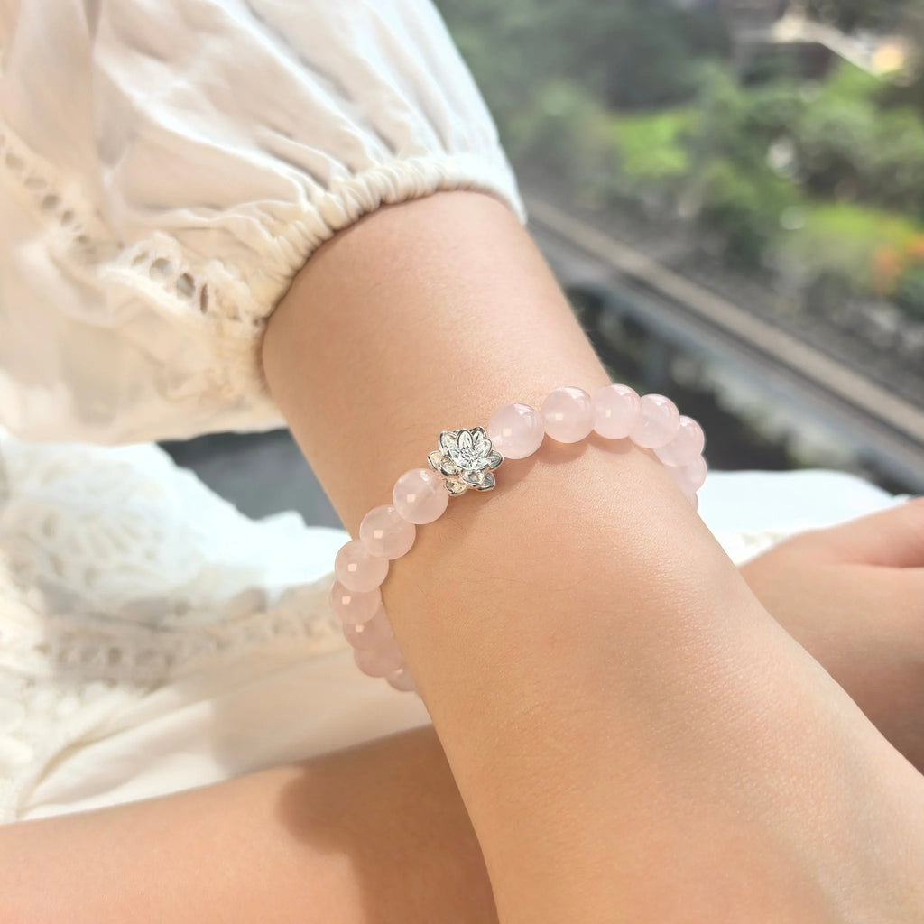 Women wearing Lotus Emotion Renewal Rose Quartz Bracelet, delicate spiritual crystal jewelry