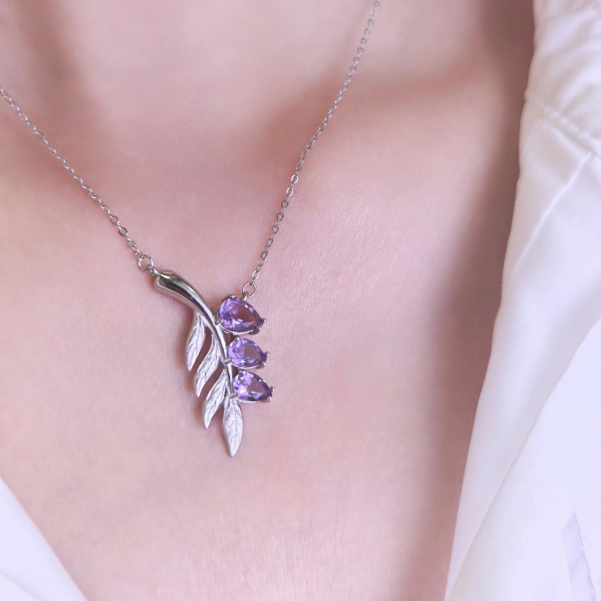 Woman wearing dainty silver lavender sprig amethyst necklace everyday spiritual crystal jewelry for women