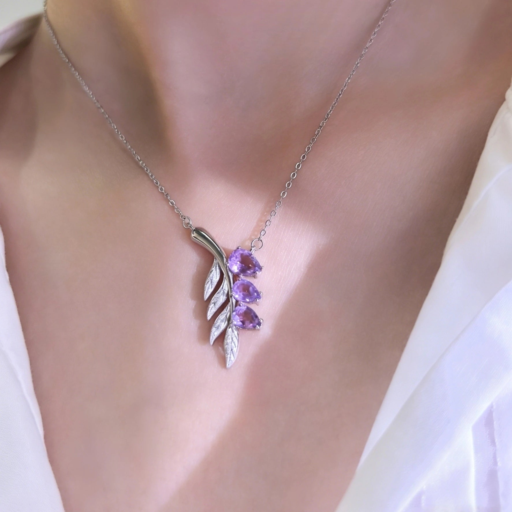 Woman wearing dainty silver lavender sprig amethyst necklace everyday spiritual crystal jewelry for her